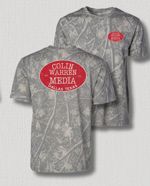 Gray camouflage crewneck t-shirt with a red oval graphic on the front reading 'COLIN WARREN MEDIA DALLAS TEXAS' and a smaller matching graphic on the left chest, shown from both front and back views.